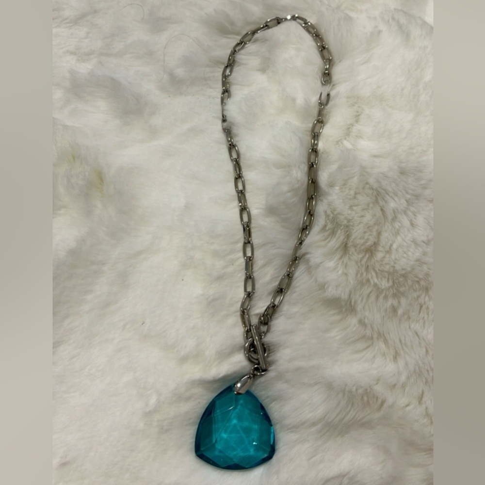 Sterling silver with blue heart shape gem